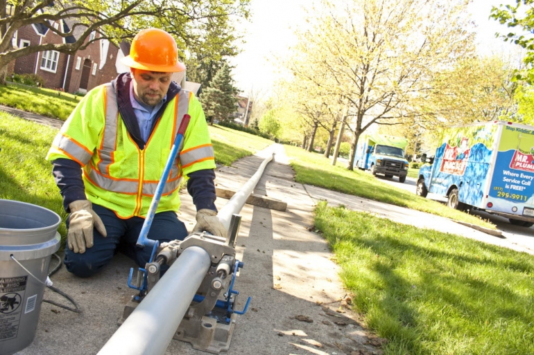 Sewer line worker
